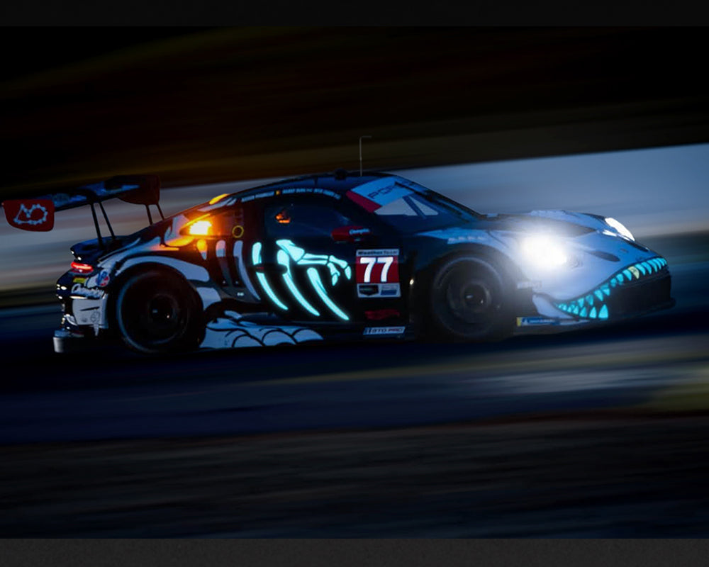 [PRE-ORDER] Estimated arrival April 2027| Mini GT 1:64 Porsche 911 GT3 R (992) #77 AO Racing “Skeleton Rexy” 2026 IMSA Petit Le Mans – (Glow in the Dark) – Limited Edition